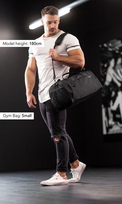 Fitgriff® Sportowa torba na siłownię dla mężczyzn i kobiet - z przegrodą na buty i kieszenią na mokre ubrania - torba fitness Pełna Czerń 58 x 31 x 31 cm (Medium)